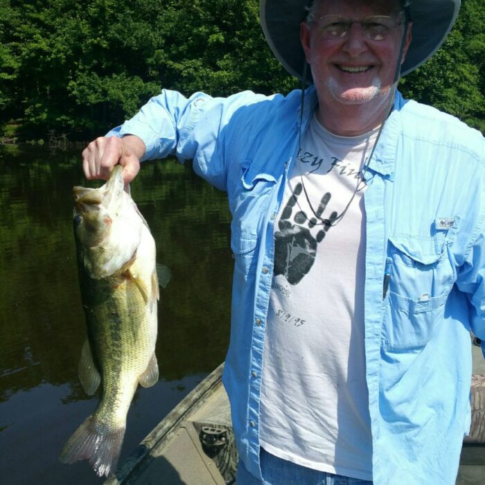 man holding up fish