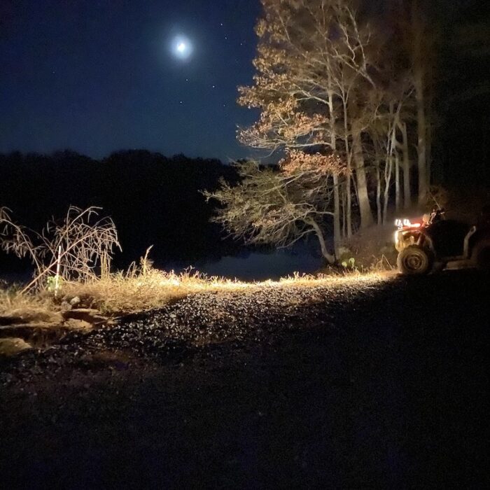 moon shining on all terrain vehicle and duck hunting location