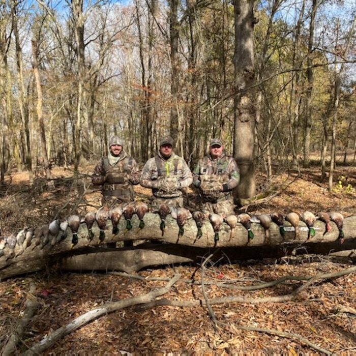 hunters with hunted ducks