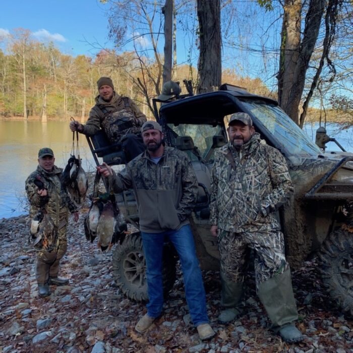duck hunters with all terrain vehicle