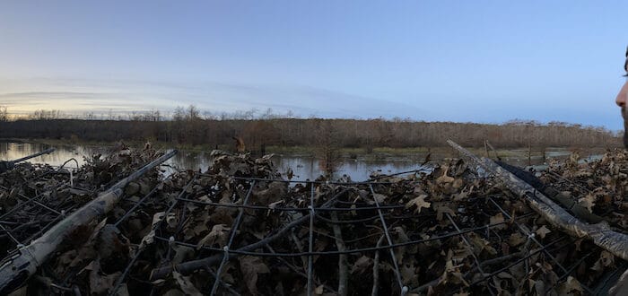 duck hunter sitting in a blind